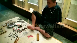 Man paints impressive art works with his feet