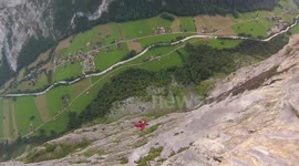 Professional base jumper crash-lands in trees