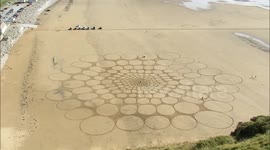 Huge sand design appears on UK beach