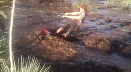 Teen surfs fast-flowing floodwaters in Arizona