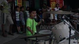 Seven-year-old drummer's impressive street performance