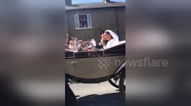 US student gets up-close view of Harry and Meghan as carriage passes right in front of her