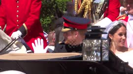 Crowds greet newlyweds Prince Harry and Meghan Markle after their marriage ceremony