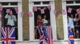 Royal Wedding Windsor people dancing on there balcony with harry and megan face masks on by Jim Connor