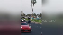 Man stands on moving motorbike during Qatar's Ramadan Parade