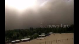 Giant wall of sand: Storm shrouds Chinese city in murky yellow dust