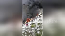 Massive fire sweeps through residential building in Russia
