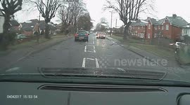Car reversing accross road