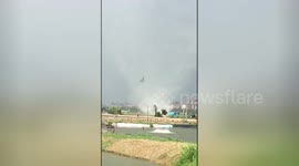 Tornado sends debris spinning into the sky in southern China