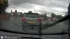 Drivers going through red light very late.
