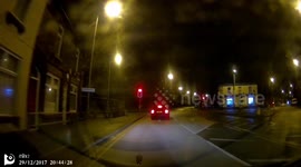 BMW jumping a red light then nearly losing control