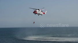 Coastguard helicopter rescues injured walker at Mousehole in Cornwall