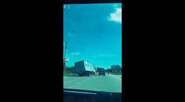 The truck driver steering out of an accident with a container truck miraculously
