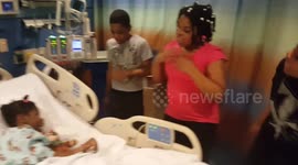 Siblings cheer up their sister in the hospital with a little Bob Marley