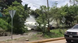 Smoking wreckage of plane crash seen on Honduras street