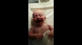 Cute baby finds his dad hysterically funny