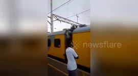 Passenger hanging out of train slaps commuter waiting on platform