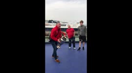 Road-tripping Liverpool fans play catch with replica Champions League trophy on ferry