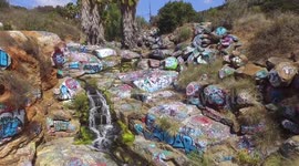 Vlogger takes risky journey to San Diego's sprawling, graffiti-covered Adobe Falls