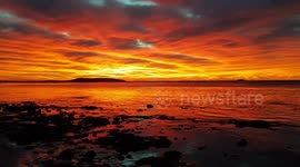 The sunrise is so red in victor harbor skies it looks like fire