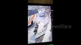Terrifying moment armed man robs woman on busy road