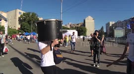 Real Madrid fan dances with a drum on his head before final