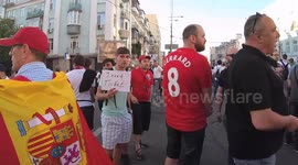 Football Fans with a sign -