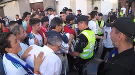 football Fans in line for police inspection in front of the football match Real Liverpool near the Olympic Stadium in Kiev before the start of the Champions League final in Kiev, Ukraine. uefa