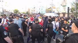 football Fans in line for police inspection in front of the football match Real Liverpool near the Olympic Stadium in Kiev before the start of the Champions League final in Kiev, Ukraine. uefa