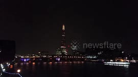London's iconic Shard tower lit up by lightning