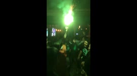 Real Madrid fans celebrating the win at the final whistle