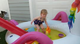 Toddler dances in the pool