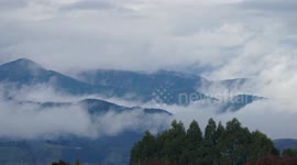 Timelapse as clouds wisp and flow over the mountains and trees, Richmond Ranges New Zealand