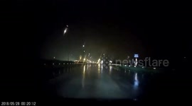 Streetlight explode on the highway causing the driver to startle