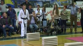 Teenager smashes blocks with head to break