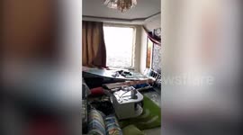 China tornado rips roofs from houses