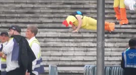 Man Dressed As Chicken Rolls Down Stairs