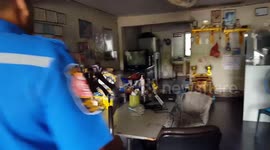 Monitor lizard caught after raiding family's kitchen for food