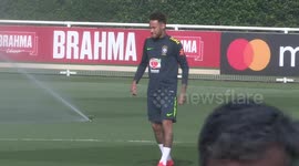 Neymar got soaked by sprinkler and doesn't look very happy about it