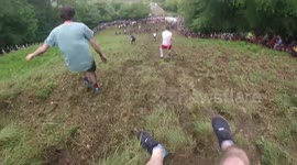 ‘Watch out, lads!’: See organizers catch man after his wild descent downhill at cheese race