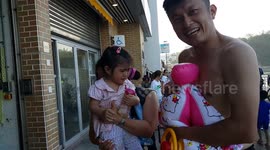 a little two years old girl cry for the flatting swimming float...daddy please don't deflate the swimming float...