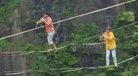French slackliners perform concert above 1,400m-high cliffs
