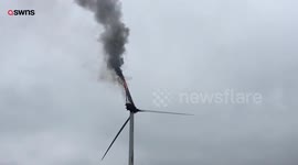 A wind turbine catches fire after thunder and lightening strikes