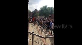 Newsflare Edit - Tommy Robinson protesters chant loudly outside Leeds Crown Court