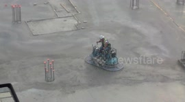 Cement smoothing machine, while building under construction.