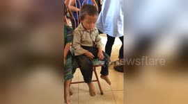 Too cute! Boy can't keep his eyes open after early morning start