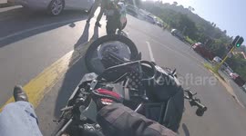 Moment motorcyclist sideswiped by car after breezing through junction