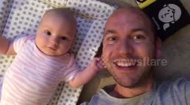 Baby daughter dancing with daddy