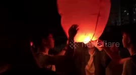 High school seniors light sky lanterns to make good wishes for university entrance exam