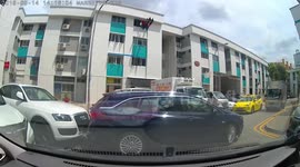 Hilarious moment driver is caught in failed reverse parking attempts